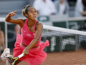 Canada's Leylah Fernandez eyes the ball as he plays a shot against Denmark's Clara Tauson during their second round match of the French Open tennis tournament at the Roland Garros stadium in Paris, Wednesday, May 31, 2023. Two Canadians -- Fernandez and Bianca Andreescu -- who failed to make big runs in singles action at the French Open are making noise in doubles competition.