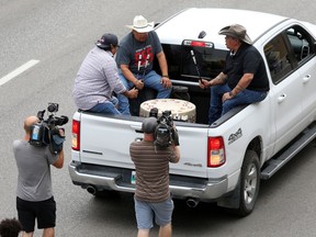 Participants drum during an Indigenous Day walk