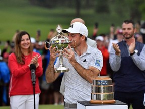 Nick Taylor kisses the trophy after winning the RBC Canadian Open.