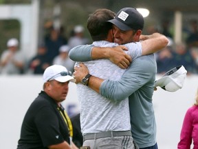 Nick Taylor is congratulated by Corey Conners after winning the RBC Canadian Open earlier this year.