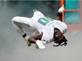 Tyreek Hill of the Miami Dolphins runs onto the field during player introductions prior to the game against the Houston Texans at Hard Rock Stadium on November 27, 2022 in Miami Gardens, Florida.