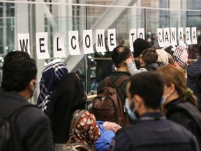 Afghan refugees arrive at Vancouver International Airport on Jan. 19, 2022.