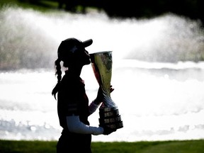 France's Celine Boutier kisses the trophy during the Evian Championship, a women's LPGA major golf tournament in Evian-les-Bains, French Alps, on July 30, 2023.