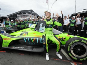 Christian Lundgaard celebrates with his Rahal Letterman Lanigan Racing teammates after winning the pole position for the 2023 Honda Indy Toronto in Toronto on Saturday, July 15, 2023.