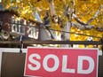 A real estate sold sign hangs in front of a west-end Toronto property Friday, Nov. 4, 2016.