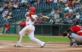 Goldeyes catcher Chris Burgess connects with a RedHawks pitch last night. The Goldeyes won 8-2. David Mahussier photo