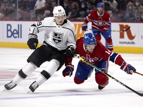 Los Angeles Kings center Rasmus Kupari (89) nudges Montreal Canadiens center Nick Suzuki (14) to the ice during NHL action in Montreal, on Tuesday, November 9, 2021.