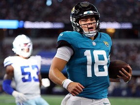 Nathan Rourke of the Jacksonville Jaguars carries the ball on a touchdown run against the Dallas Cowboys in a preseason game in Arlington, Texas.