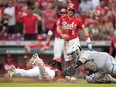 Elly De La Cruz of the Reds scores on a throwing error by Cavan Biggio of the Blue Jays after hitting a triple in the fourth inning at Great American Ball Park on August 19, 2023.