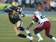 Winnipeg Blue Bombers SB Milt Stegall tries to beat Montreal Alouettes DB Drew Randee during CFL action at Canad Inns Stadium.