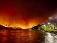 Residents watch the McDougall Creek wildfire in West Kelowna, B.C., on Aug. 17.