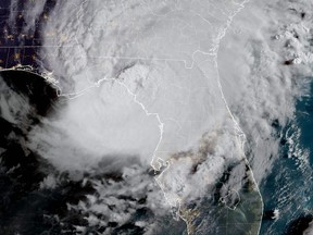 This image obtained from the National Oceanic and Atmospheric Administration (NOAA), shows Hurricane Idalia making landfall in Florida on August 30, 2023, at 12h01UTC. Idalia barreled into the northwest Florida coast as a powerful Category 3 hurricane on Wednesday morning, the US National Hurricane Center said. "Extremely dangerous Category 3 Hurricane #Idalia makes landfall in the Florida Big Bend," it posted on X, formerly known as Twitter, adding that Idalia was causing "catastrophic storm surge and damaging winds."