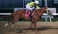 Jockey Antonio Whitehall rides Mano Dura to the win in the 75th Manitoba Derby at Assiniboia Downs on Monday, Aug. 7, 2023.