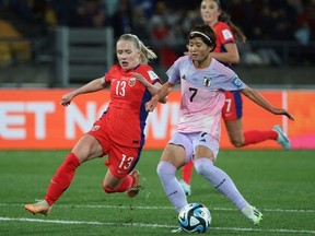 Japan's midfielder #07 Hinata Miyazawa (R) and Norway's midfielder #13 Thea Bjelde fight for the ball during the Australia and New Zealand 2023 Women's World Cup round of 16 football match between Japan and Norway at Wellington Regional Stadium in Wellington on August 5, 2023.