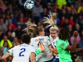 England's forward #11 Lauren Hemp (R) competes for the ball during the Australia and New Zealand 2023 Women's World Cup round of 16 football match between England and Nigeria at Brisbane Stadium in Brisbane on August 7, 2023.