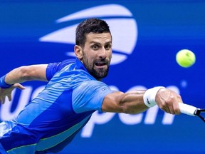 Serbia's Novak Djokovic plays a backhand return against France's Alexandre Muller during the US Open tennis tournament men's singles first round match at the USTA Billie Jean King National Tennis Center in New York City, on August 28, 2023.