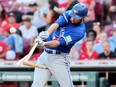 Brandon Bell of the Blue Jays breaks his bat while hitting against the Cincinnati Reds at Great American Ball Park on August 18, 2023 in Cincinnati.