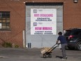 A "Now Hiring" sign is displayed on a business in Montreal on Tuesday, May 30, 2023. Statistics Canada is set to release its July job report this morning.
