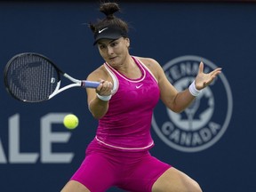 Bianca Andreescu of Canada, hits a return to Camila Giorgi of Italy, during the National Bank Open tennis tournament in Montreal, Tuesday, August 8, 2023.