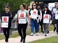 MGEU picketers outside the MPI service centre