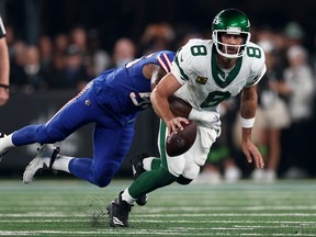 Quarterback Aaron Rodgers #8 of the New York Jets is sacked by defensive end Leonard Floyd #56 of the Buffalo Bills during the first quarter of the NFL game at MetLife Stadium on Monday, Sept. 11, 2023, in East Rutherford, N.J.