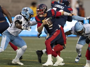 Montreal Alouettes quarterback Cody Fajardo (7) is sacked by Toronto Argonauts linebacker Wynton McManis (48) during first half CFL football action in Montreal, Friday, Sept. 15, 2023.