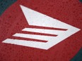 Rain beads off the hood of an electric delivery vehicle emblazoned with the Canada Post logo after a news conference on the postal service’s plans to transform their fleet of 14,000 vehicles, in Ottawa, on Thursday, June 9, 2022.