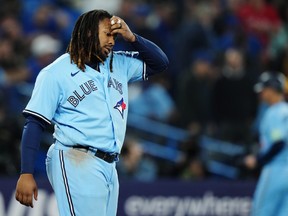 Toronto Blue Jays' Vladimir Guerrero Jr. (27) reacts after striking out against the Texas Rangers to end the seventh inning in MLB baseball action in Toronto on Thursday, Sept. 14, 2023.