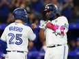 Blue Jays' Vladimir Guerrero Jr. celebrates his three-run home run against the Boston Red Sox with Daulton Varsho during the third inning in Toronto on Friday, Sept. 15, 2023.