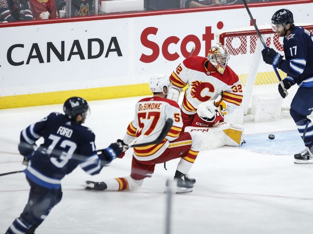 Jets' Perfetti leaves game vs. Flames after 'cheap shot' from Pospisil