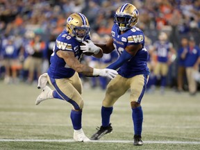 Blue Bombers running back Brady Oliveira (left) rushed 25 times for a career-high 169 yards in Friday's win over the Toronto Argonauts.