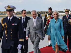 Britain's King Charles III (C) and Britain's Queen Camilla (2R) walk with France's Defense minister Sebastien Lecornu (2L) before boarding an aircraft for the United Kingdom at the end of their three day State Visit to France, at the Bordeaux-Merignac Airport in Bordeaux, southwestern France, on September 22, 2023.