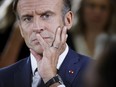 French President Emmanuel Macron listens to teachers during a visit to a vocational school in Orange, Southeastern France, Friday Sept. 1, 2023.