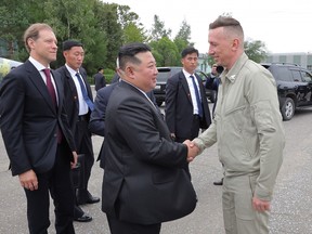 This picture taken on Sept. 15, 2023 and released by North Korea's official Korean Central News Agency (KCNA) on Sept. 16, 2023 shows North Korean leader Kim Jong Un (centre) shaking hand with the pilot who conducted a test flight of a Su-35 fighter jet, at the Komsomolsk-on-Amur Yuri Gagarin Aviation Plant, in Komsomolsk-on-Amur, a major industrial city in the Far Eastern Region of the Russia.