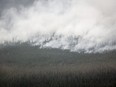 A wildfire burns south of Enterprise, N.W.T., Thursday, Aug. 17, 2023.