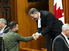 The Speaker of the House of Commons Anthony Rota shakes hands with Ukrainian President Volodymyr Zelenskyy in the House of Commons on Parliament Hill in Ottawa on Friday, Sept. 22, 2023.