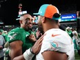 Jalen Hurts of the Philadelphia Eagles and Tua Tagovailoa of the Miami Dolphins talk after a game.