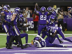 Camryn Bynum of the Minnesota Vikings celebrates his game-ending interception against the San Francisco 49ers.