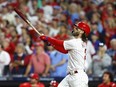 Bryce Harper #3 of the Philadelphia Phillies hits a solo home run against Brad Hand #45 of the Atlanta Braves during the fifth inning in Game Three of the Division Series at Citizens Bank Park on October 11, 2023 in Philadelphia, Pennsylvania.