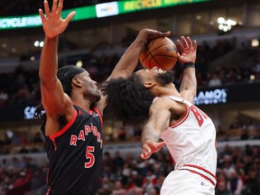 Precious Achiuwa of the Toronto Raptors blocks a shot by Coby White of the Chicago Bulls during the first half at the United Center on October 27, 2023 in Chicago.