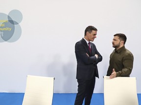 In this photo provided by the Spanish government, Spain's acting Prime Minister Pedro Sanchez, left, speaks with Ukraine's President Volodymyr Zelenskyy at the Europe Summit in Granada, Spain, Thursday, Oct. 5, 2023. Almost 50 European leaders are using a summit in southern Spain's Granada to stress they stand by Ukraine at a time when Western resolve appears somewhat weakened. Ukrainian President Volodymyr Zelenskyy retorted on Thursday that maintaining such unity was now "the main challenge."