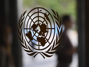 The UN logo is seen on a door at the United Nations headquarters ahead of the 78th session of the United Nations General Assembly in New York City on September 15, 2023.