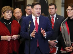 Minister of Public Safety Marco Mendicino speaks to reporters in the foyer of the House of Commons on Parliament Hill in Ottawa on Wednesday, Dec. 14, 2022, regarding Bill C-21.