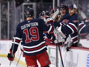 Jets defenceman David Gustafsson celebrates his goal against the Blues.