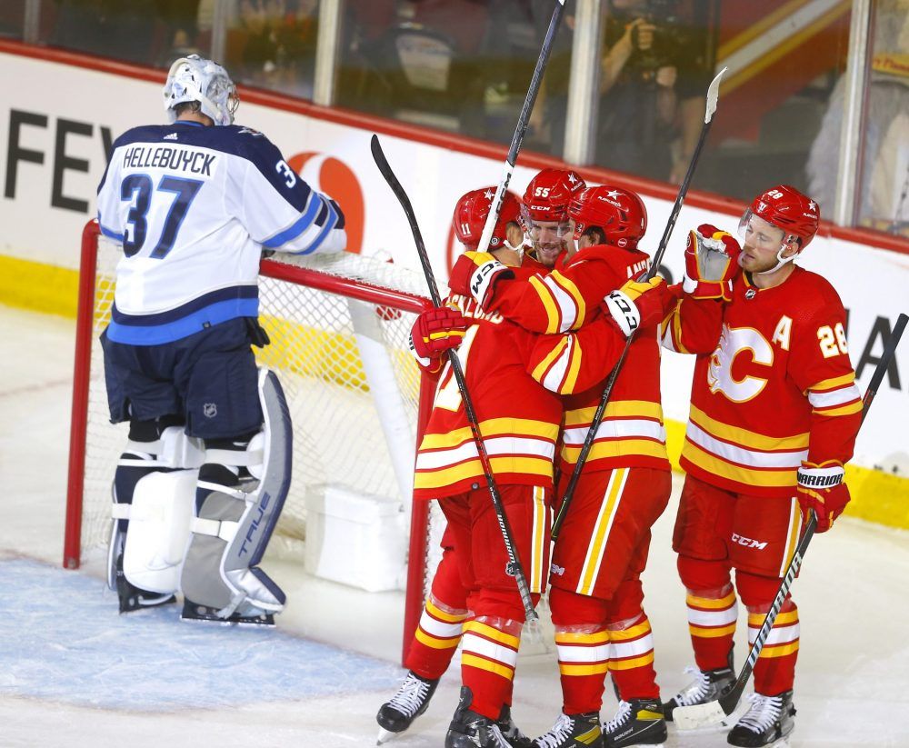 Andrew Mangiapane has 2 goals and an assist, Flames beat Jets 5-3 in opener, Hockey