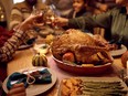 Close up of Thanksgiving turkey during family dinner at dining table.