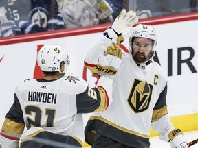 Local boys Mark Stone and Brett Howden celebrate Howden's goal in a 5-3 win Vegas Golden Knights win over the Winnipeg Jets Thursday night at Canada Life Centre.