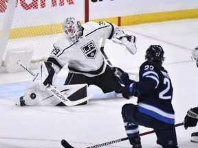 Los Angeles Kings goaltender Cam Talbot makes a save on Winnipeg Jets centre Mason Appleton (22) during first period NHL action in Winnipeg on Tuesday.