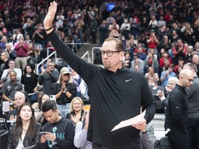 Former Raptors coach Nick Nurse salutes the crowd after a video tribute was played at Scotiabank Arena on Saturday. Nurse coached the Sixers to the win. GETTY IMAGES