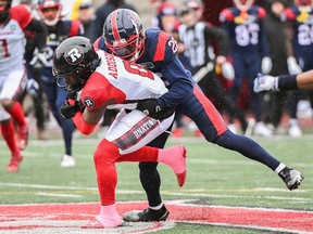 The Montreal Alouettes' Tyrice Beverette, right, tackles the Ottawa Redblacks' Bralon Addison during the second half at Molson Stadium in Montreal, Monday, Oct. 9, 2023.